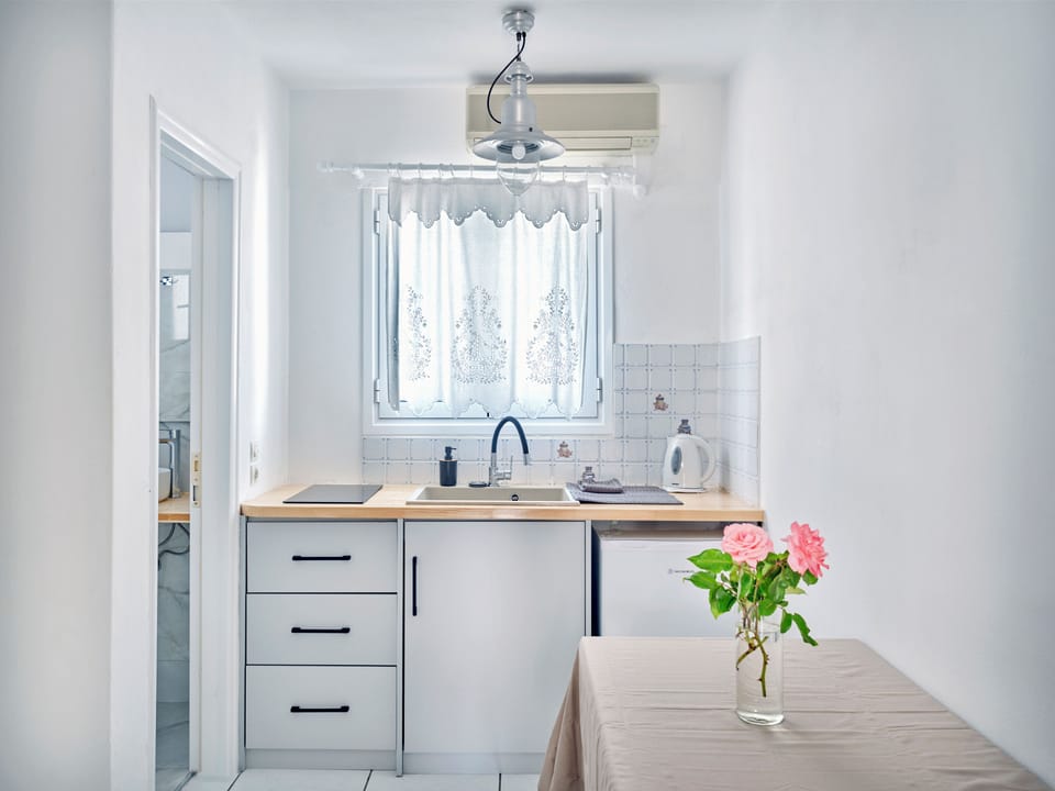 Premium Apartment, Pool View (4 Adults) | Private kitchen | Dining tables