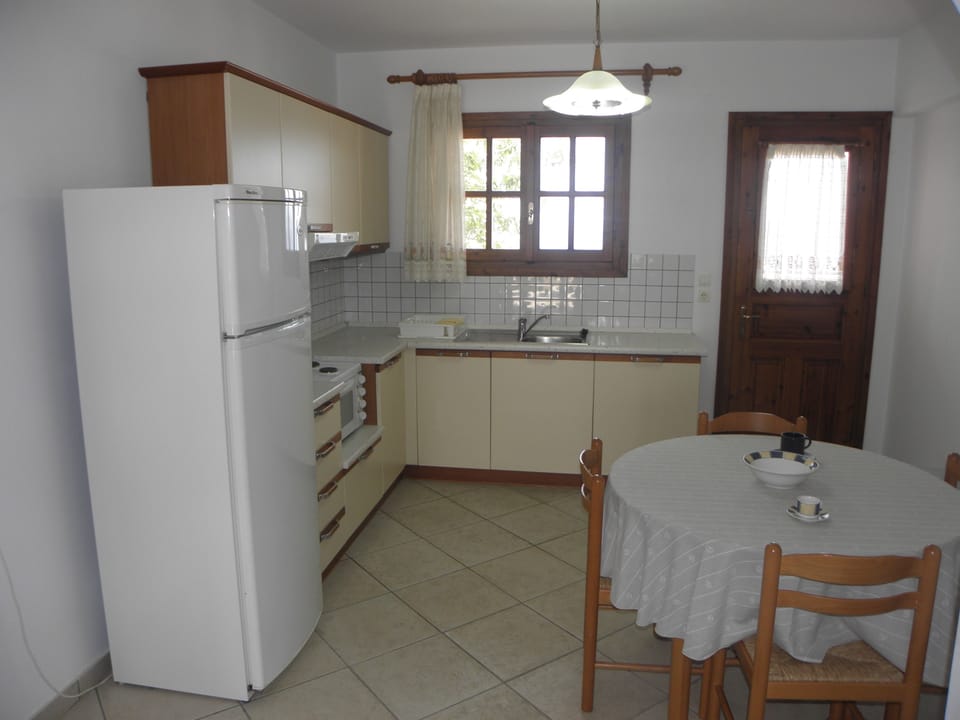 Family Apartment, 2 Bedrooms, Garden View, Oceanfront | Private kitchen | Full-size fridge, coffee/tea maker, electric kettle