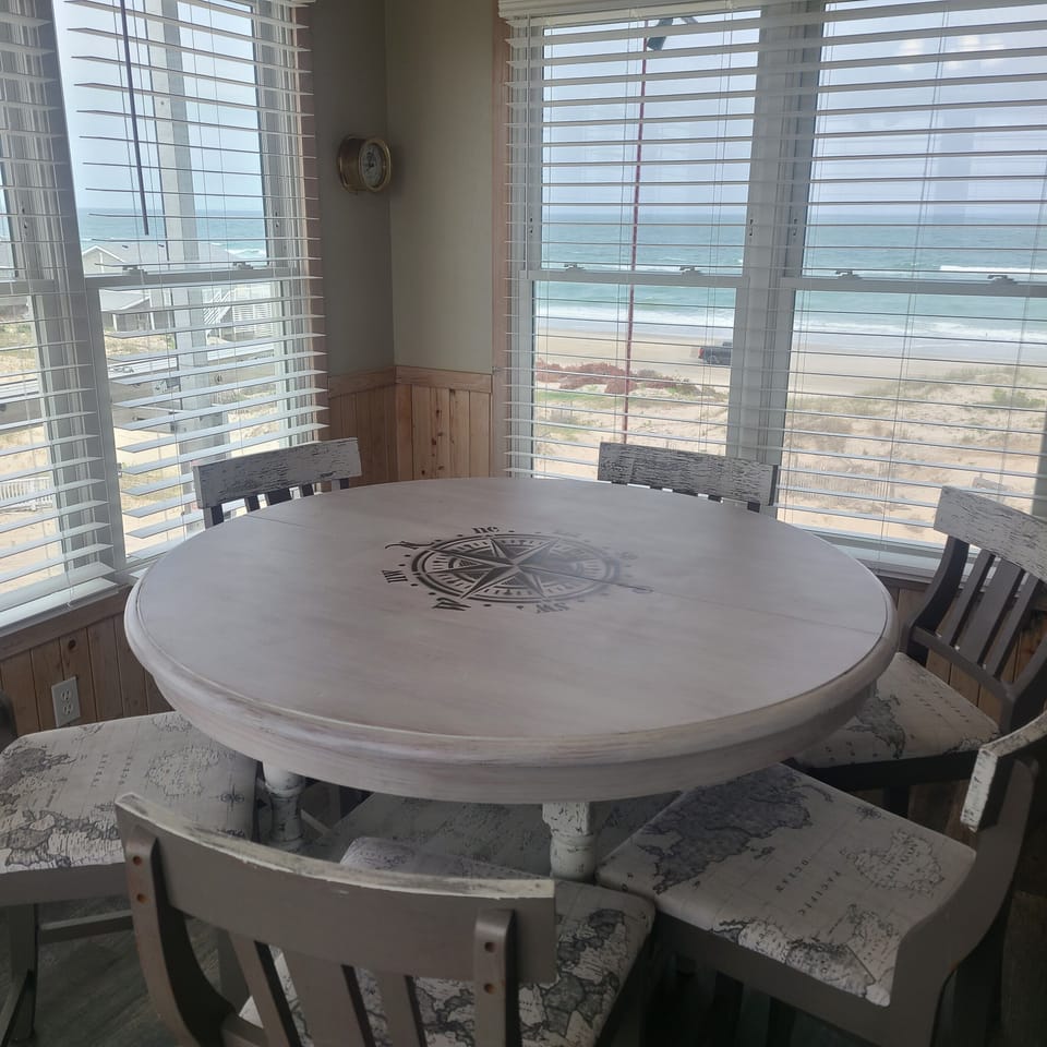 Additional seating beyond kitchen, one half flight up!  GORGEOUS views of the ocean from the entire living space in this house.
