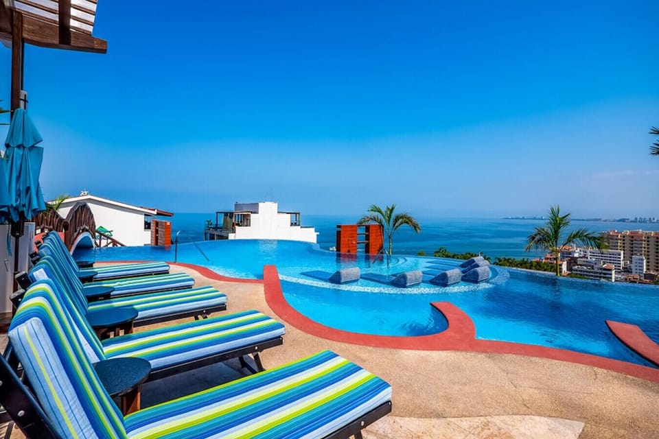 [Poolside] Lounge chairs with bar service.