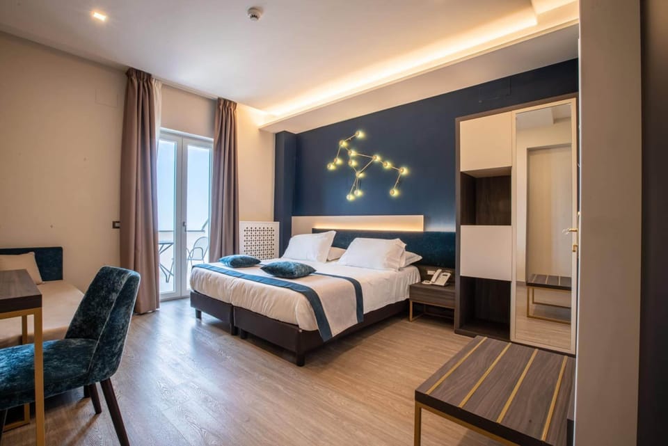 Deluxe Double or Twin Room, Sea View | Minibar, in-room safe, desk, laptop workspace