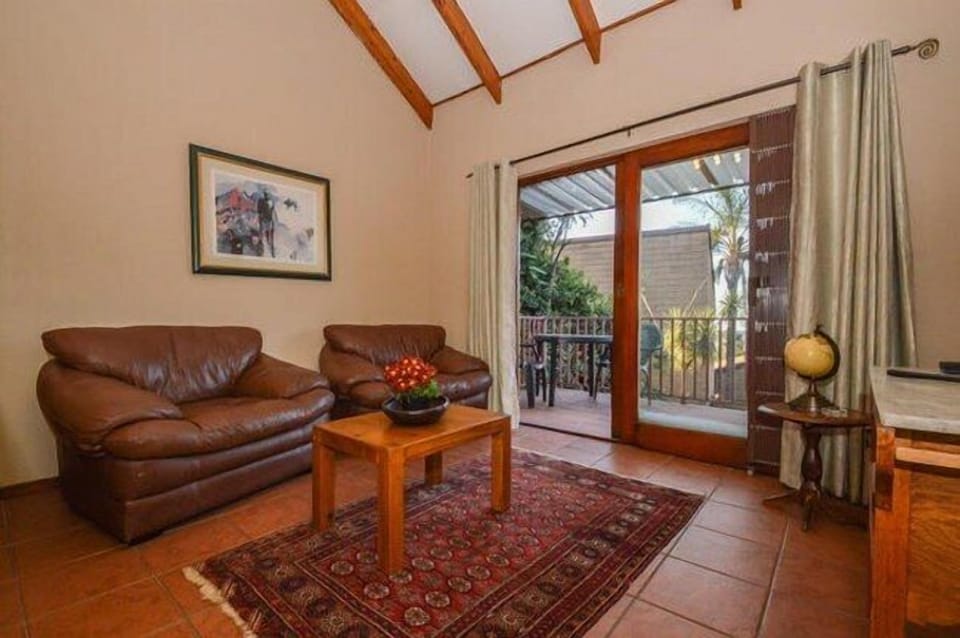 Deluxe Double Room | Living area | Flat-screen TV