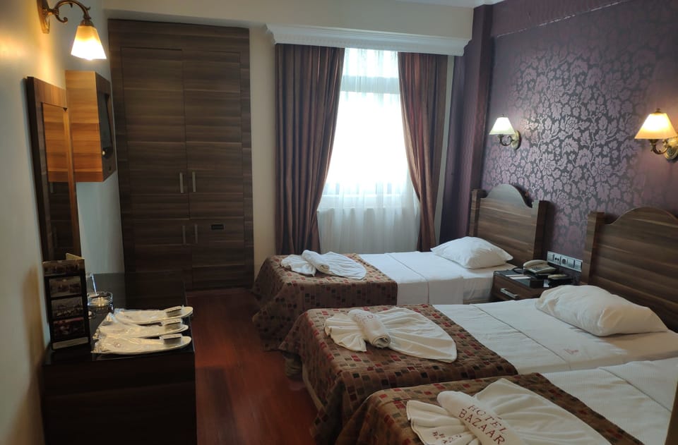 Triple Room | Premium bedding, minibar, in-room safe, desk