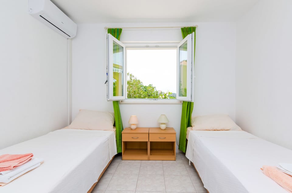 Twin Room, Patio, Garden View | Individually decorated, individually furnished, free WiFi, bed sheets