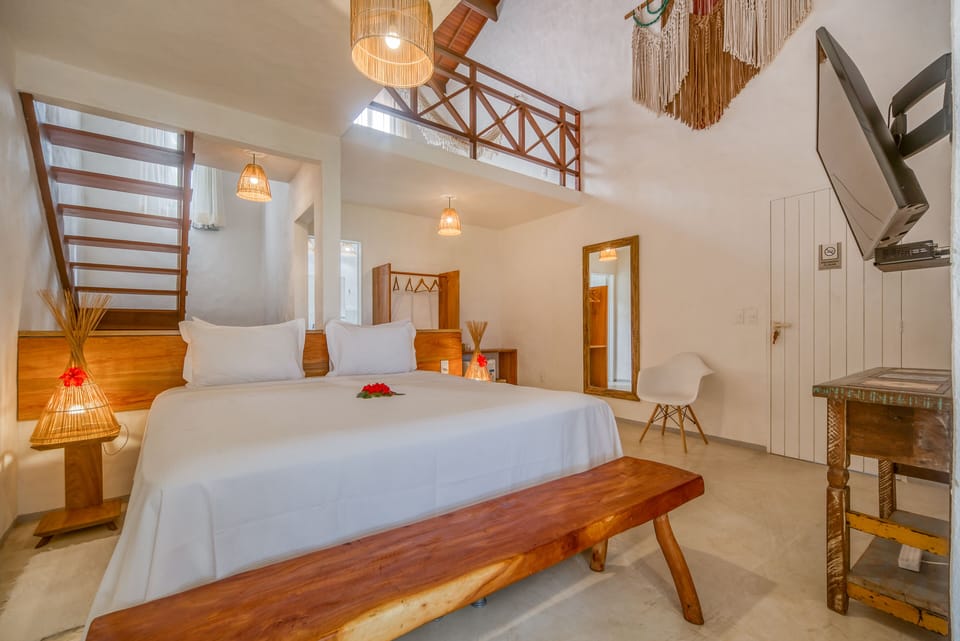 Suite Loft Vista Parcial Mar com Ofuro | Minibar, iron/ironing board, free WiFi, bed sheets