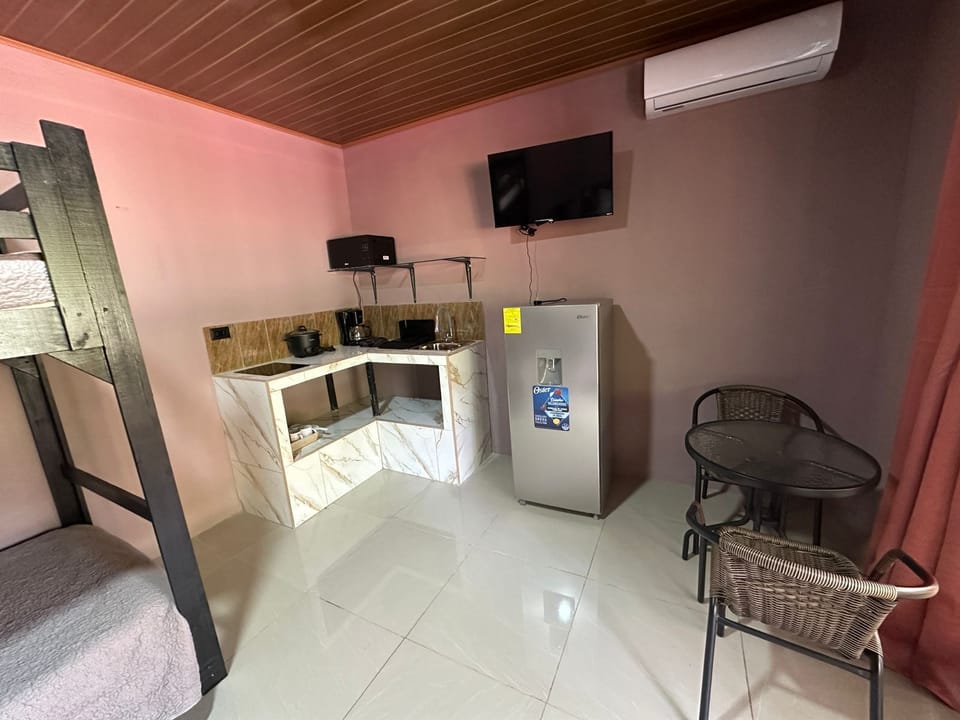 Family Quadruple Room | Private kitchen | Full-size fridge, microwave, oven, stovetop