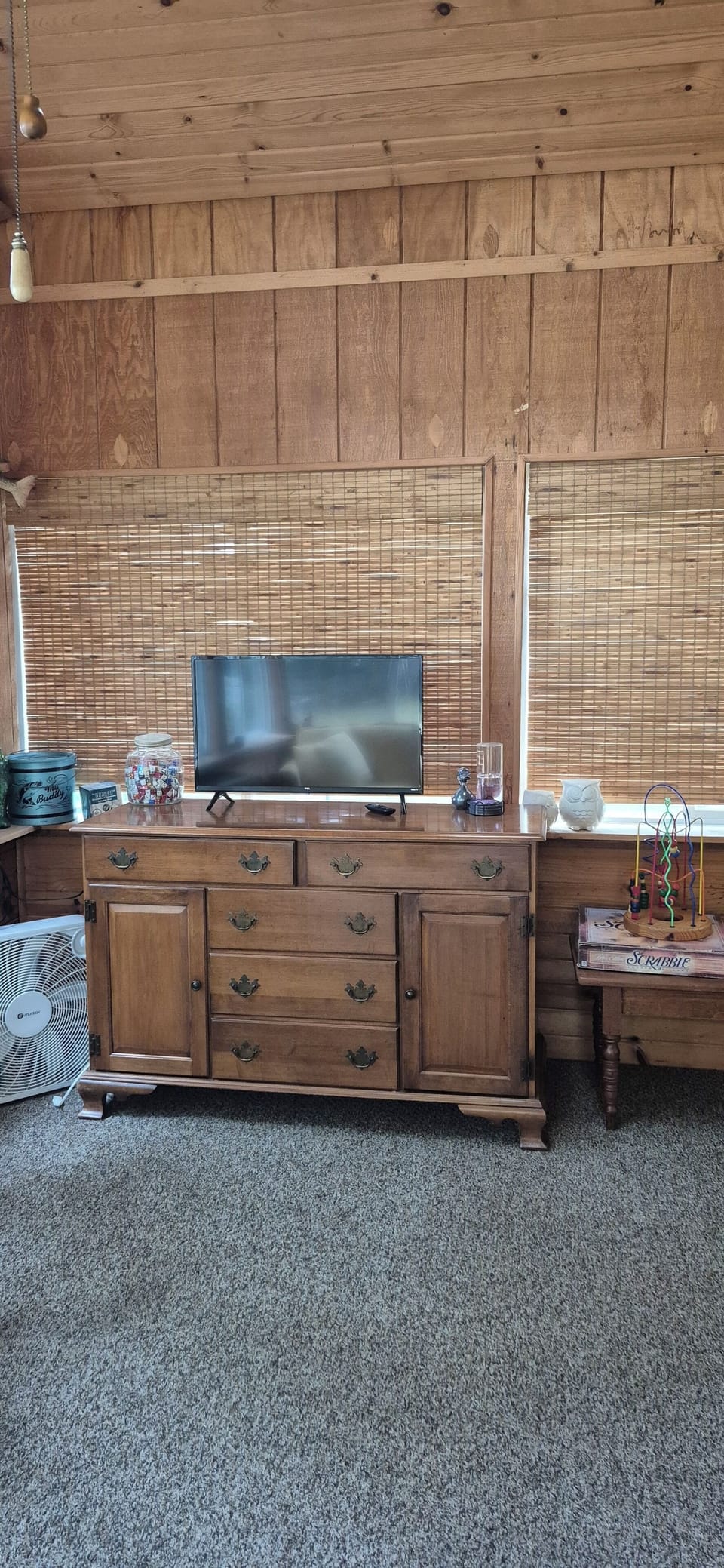 Smart TV and game/puzzle cabinet in the All Season Room.