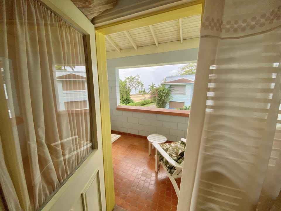 Upstairs patio with access from both rooms overlooking the beach and ocean. 
