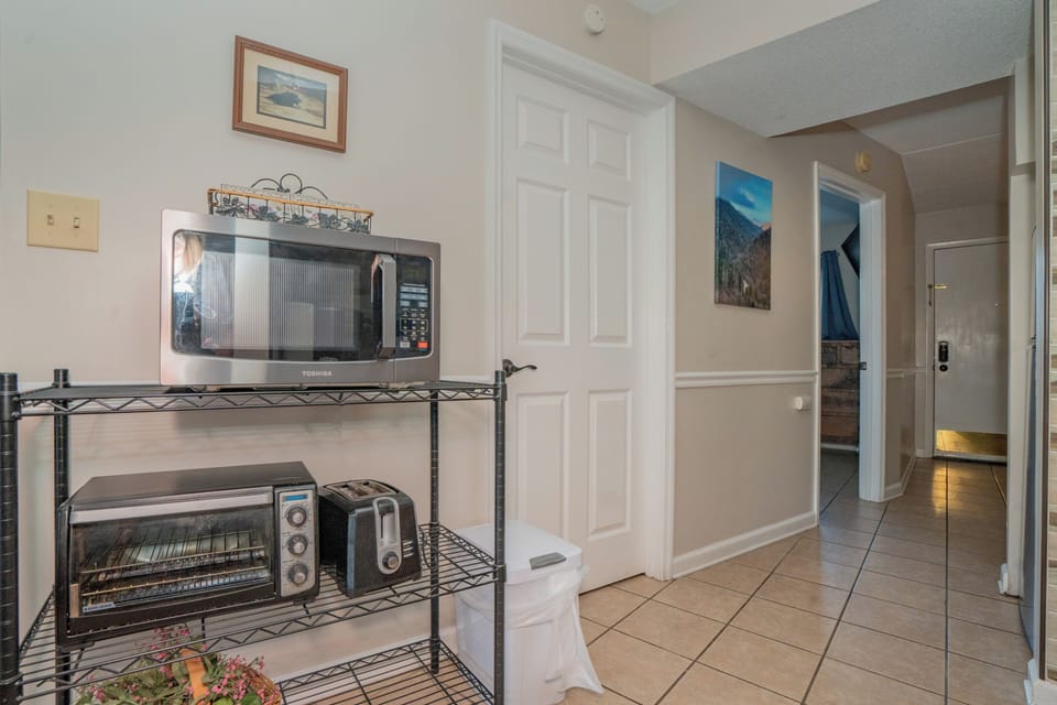A convenient kitchenette with microwave, toaster oven, and coffee maker ready for your morning routine and quick meals during your stay.
