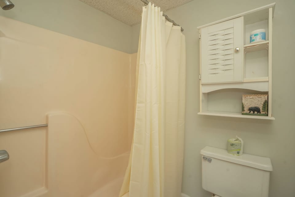 Your private bathroom features a refreshing shower and thoughtful storage, ensuring a comfortable stay with everything you need close at hand.