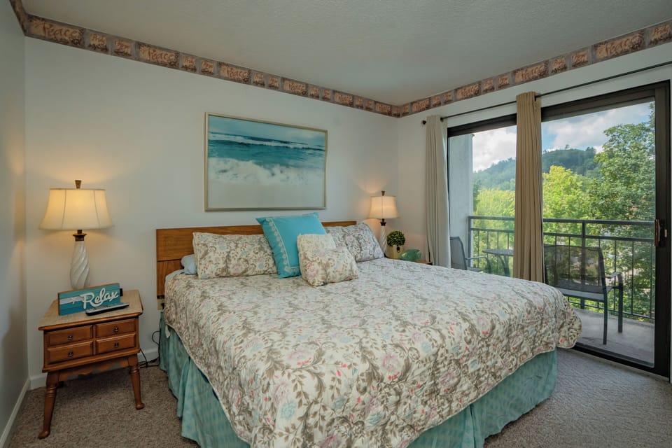 Wake up to serene mountain views from your private balcony. Soft bedding and warm lamps create a cozy retreat where you can truly relax.