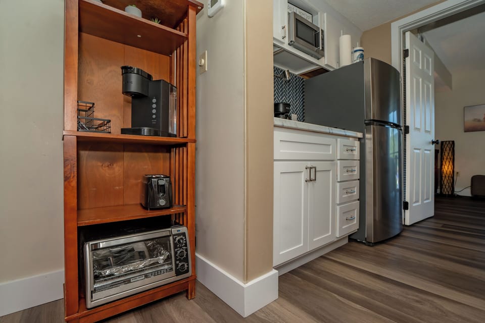 Your fully equipped kitchen features modern appliances and a thoughtful coffee station, perfect for starting your mornings at your own pace.