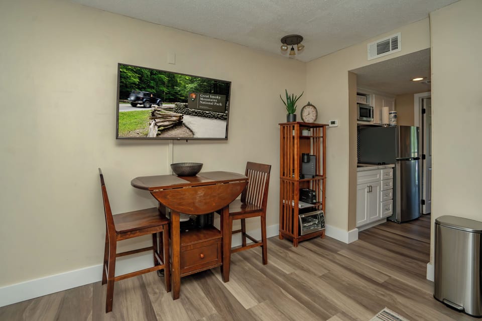 Settle in at your cozy dining nook, where a large TV and full kitchen just steps away set the stage for relaxed meals and entertaining.