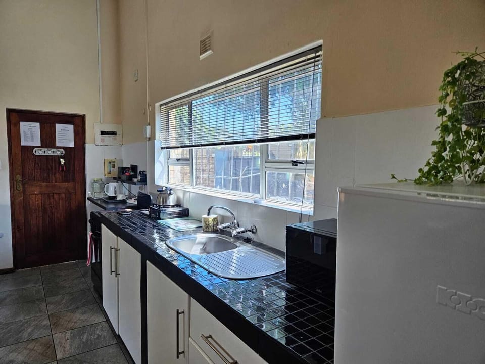 Basic Apartment | Private kitchen | Fridge, microwave, coffee/tea maker, electric kettle