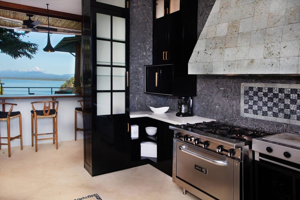 The kitchen is fully equipped with appliances fit for a chef.