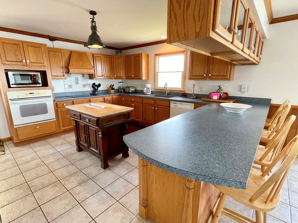 Kitchen with Breakfast Bar, First Floor with Deck Access