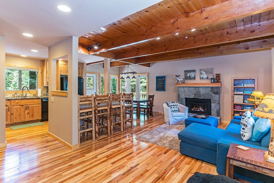 Finished with new hard wood floor, a gas fireplace and two living spaces
