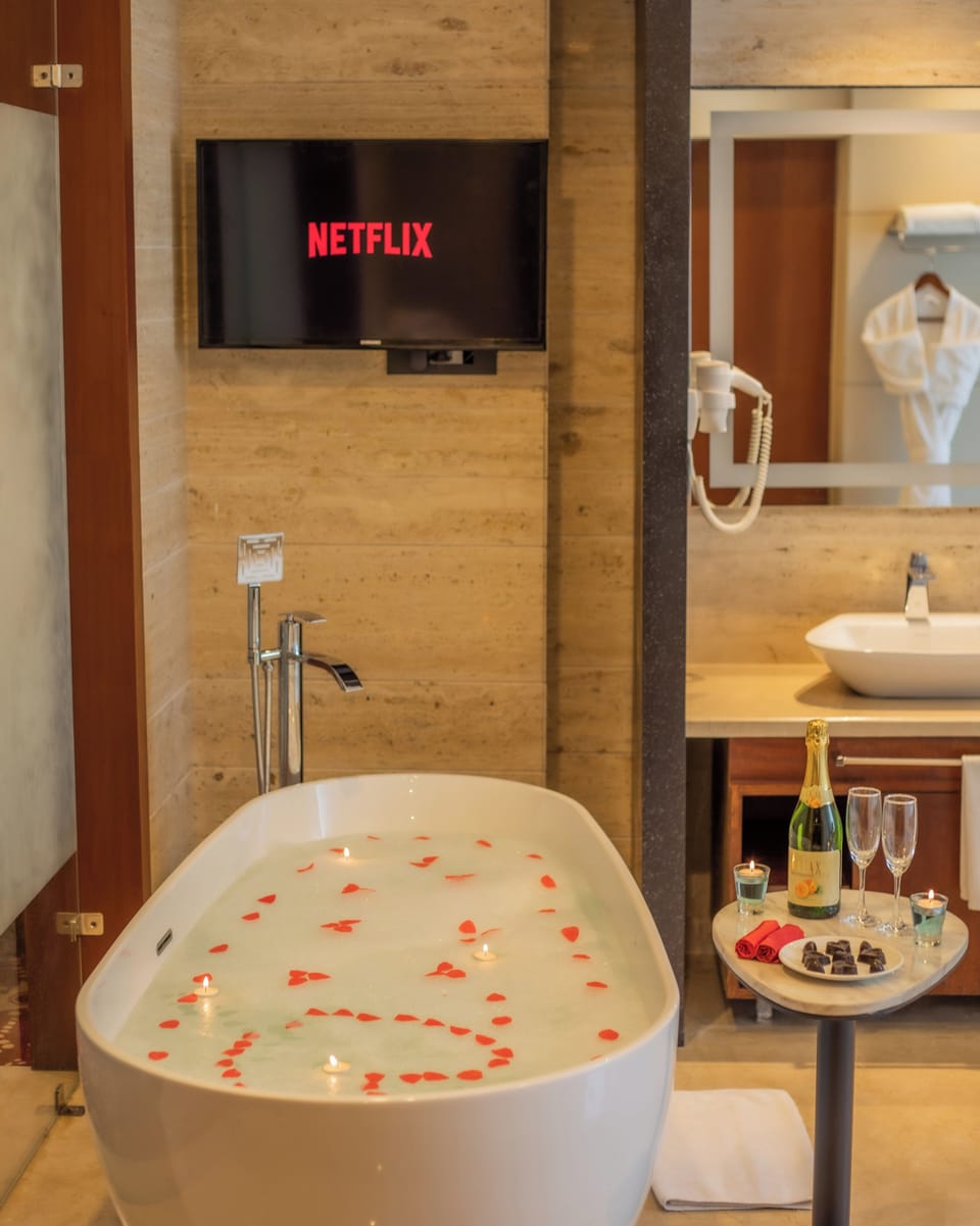 Designer toiletries, hair dryer, bathrobes, slippers
