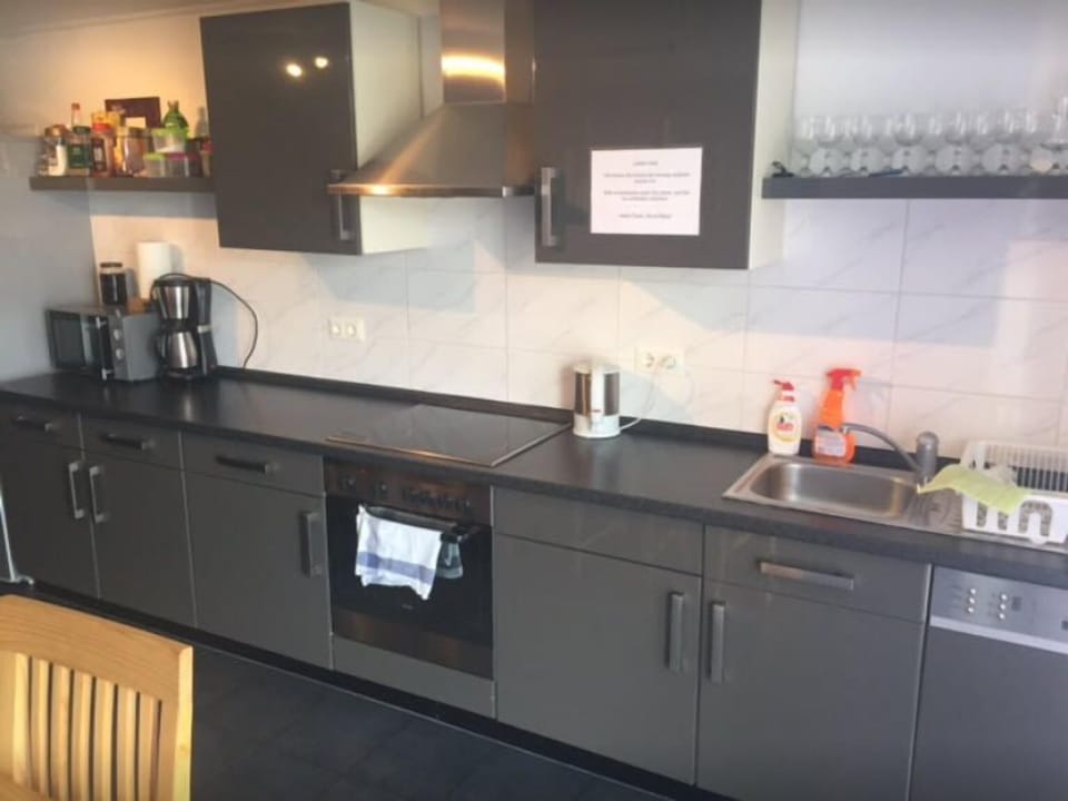 Full-size fridge, stovetop, toaster, coffee grinder