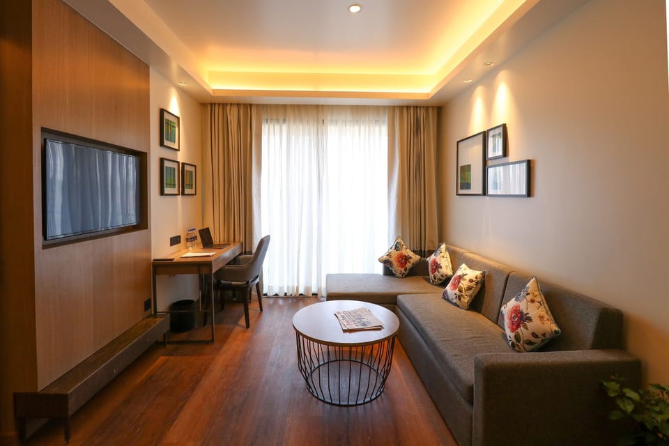 Family Studio Suite | Living area | 44-inch LED TV with digital channels, TV, foosball