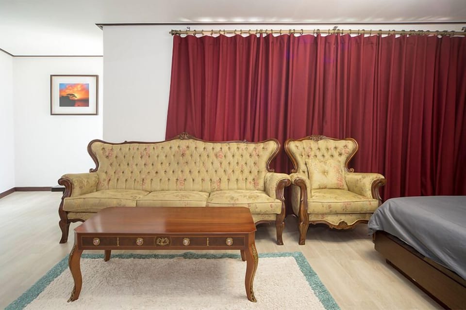 Royal Double Room | Living area | Flat-screen TV, heated floors
