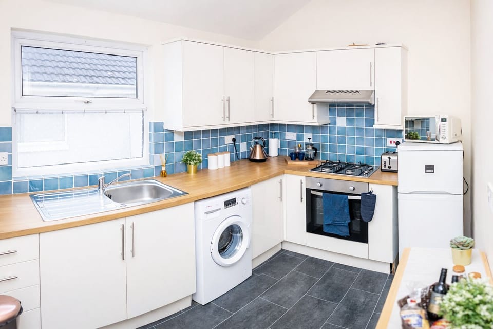 Three-Bedroom Apartment | Private kitchen | Full-size fridge, microwave, oven, stovetop