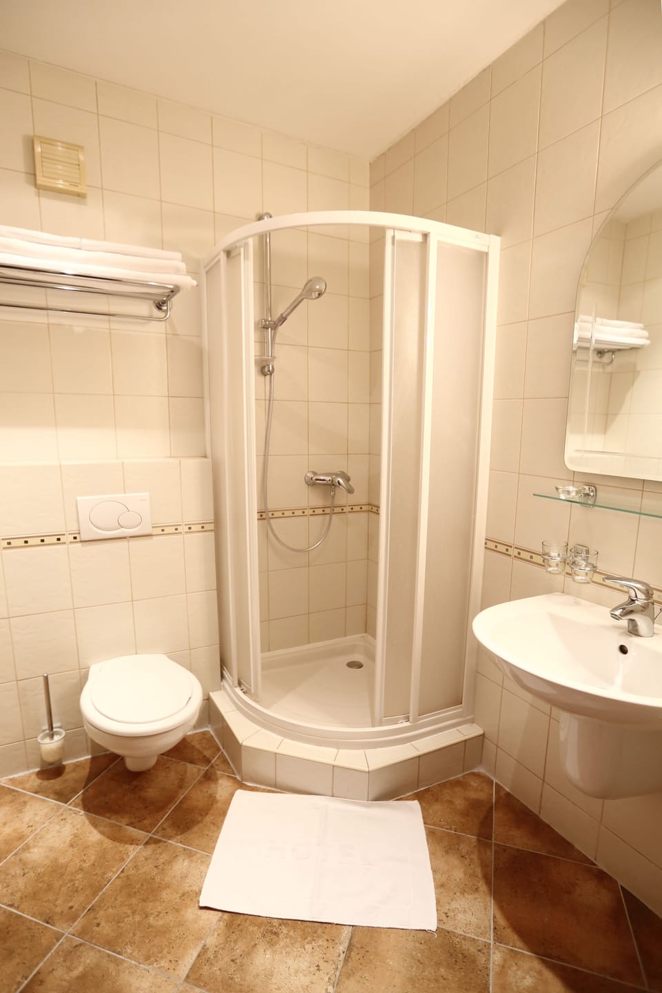 Shower, towels, soap, toilet paper
