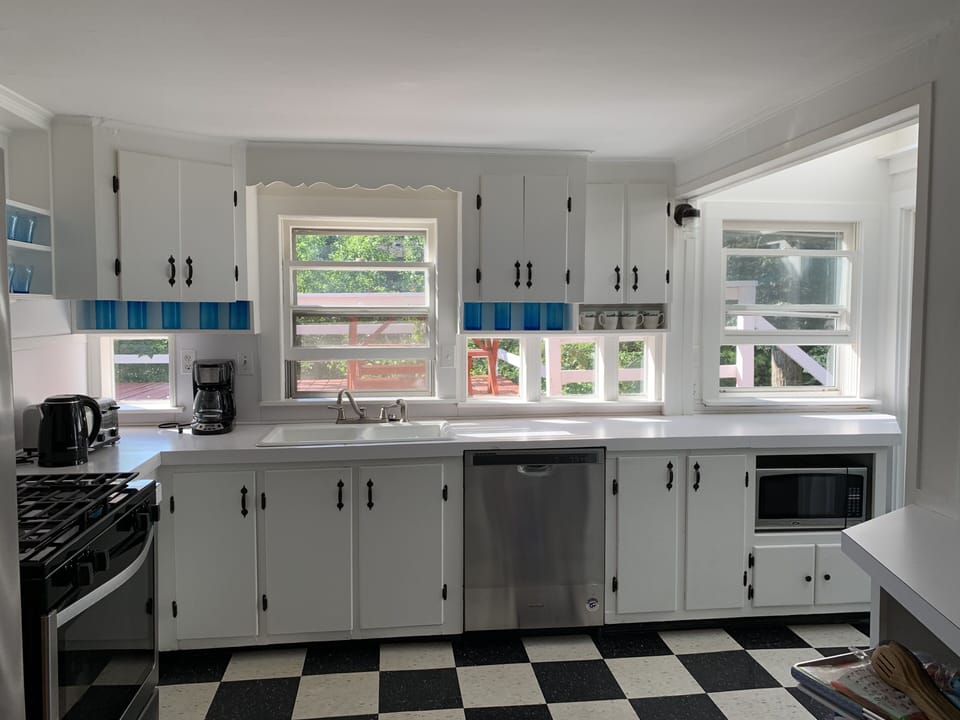 Kitchen with all new appliances and kitchen utilities 