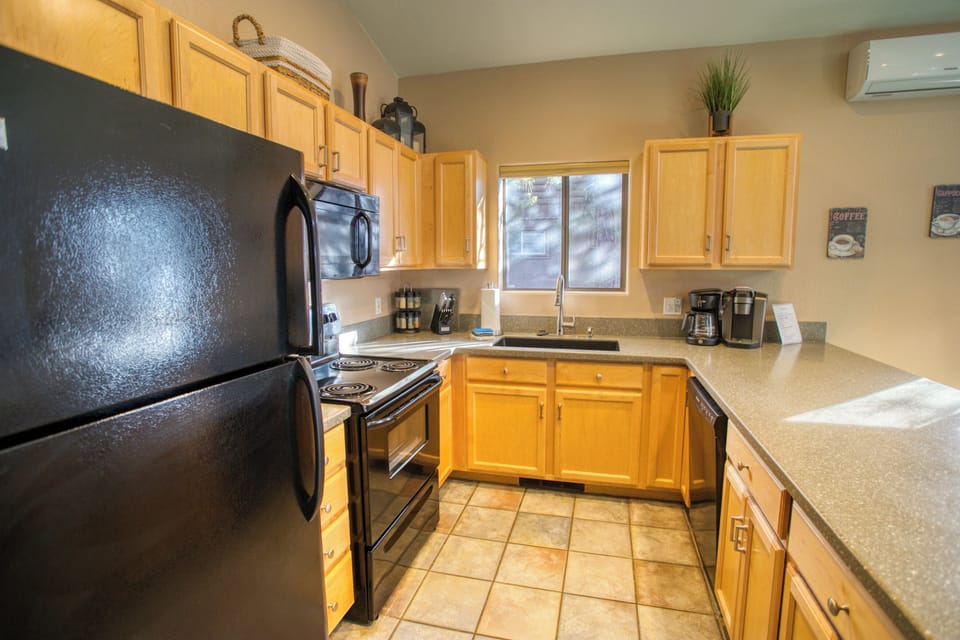 Gather in a spacious, well-stocked kitchen designed for shared meals and cozy, slow mornings together.