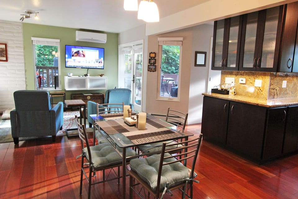 Open floor plan on main level with living room, dining area, and kitchen