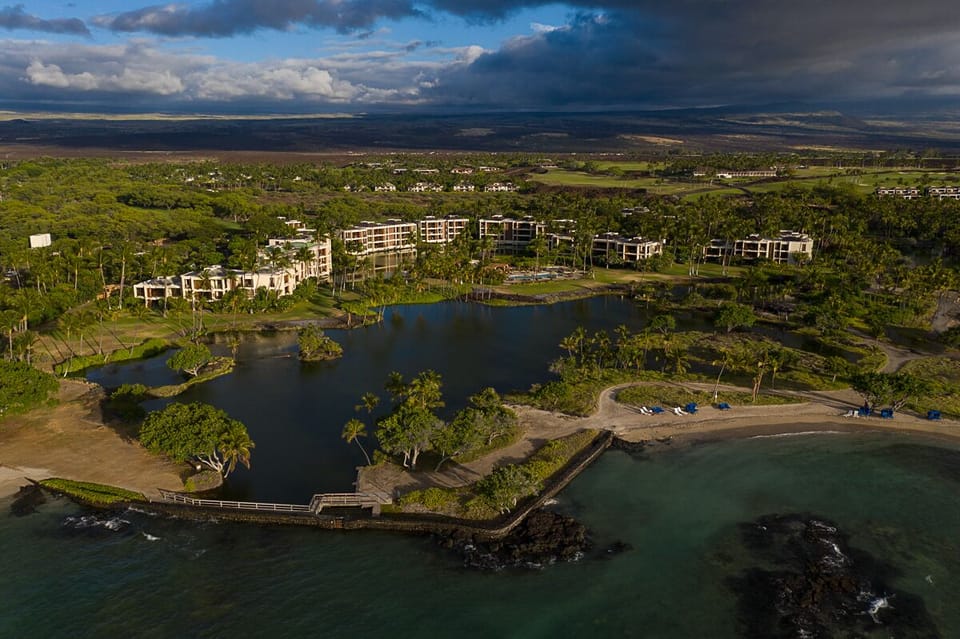 Bird’s-eye view of Mauna Lani Terrace showcasing its stunning oceanfront setting and lush surroundings.