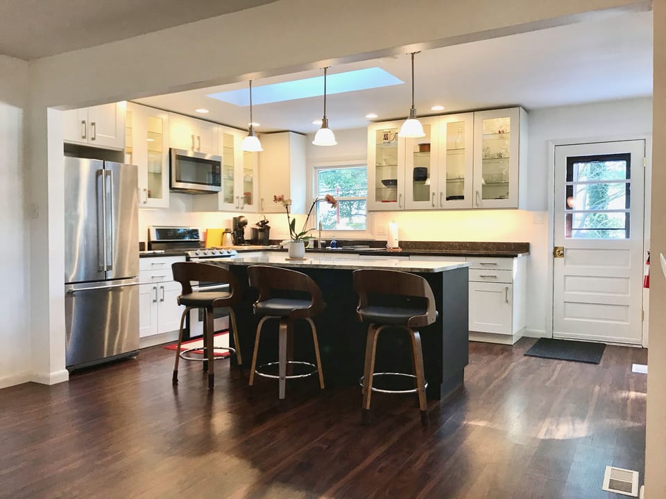 Kitchen island has build in power and USB outlets and granite counter