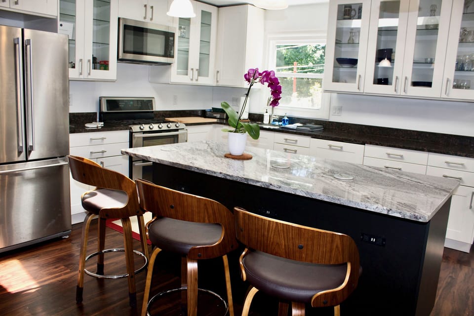 The kitchen island has built in electric and USB outlets