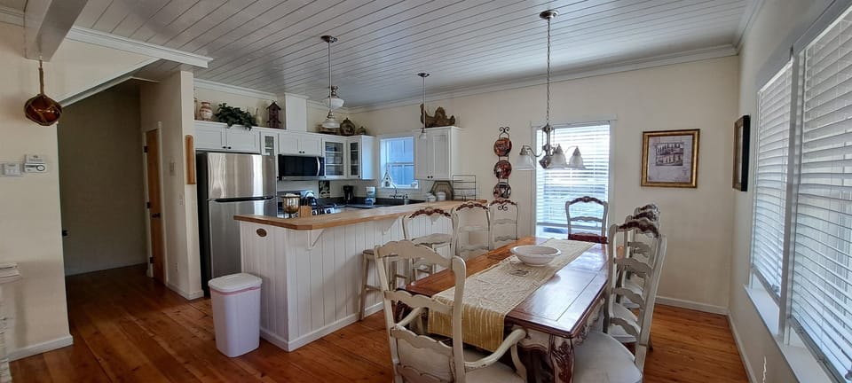 Gather around the French-Country table for 8, with additional seating at the kitchen island for family and friends.