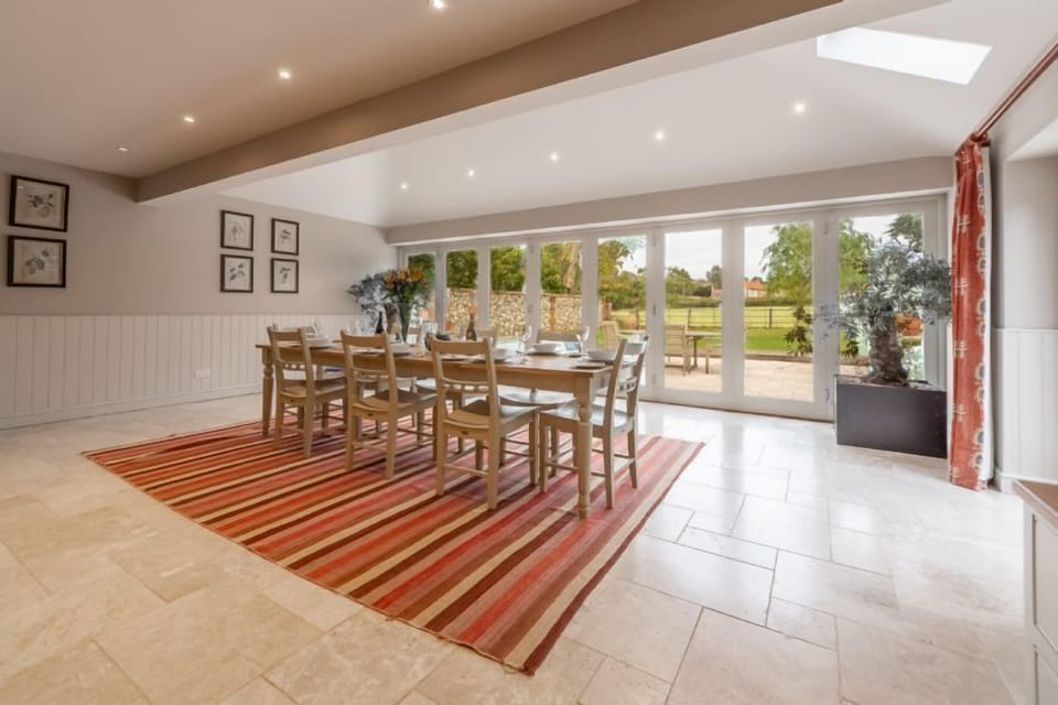 Ground floor: Dining area is light and bright with bi-fold doors to the garden