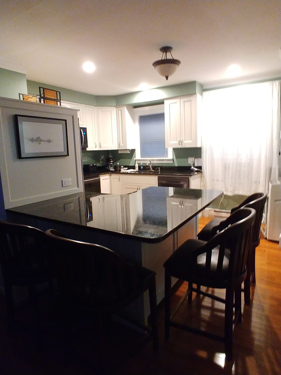 Granite eat-at counter with 4 stools.