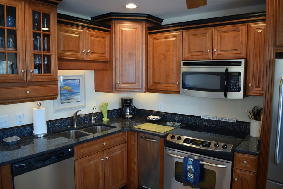 Fully stocked kitchen with new stainless appliances. 