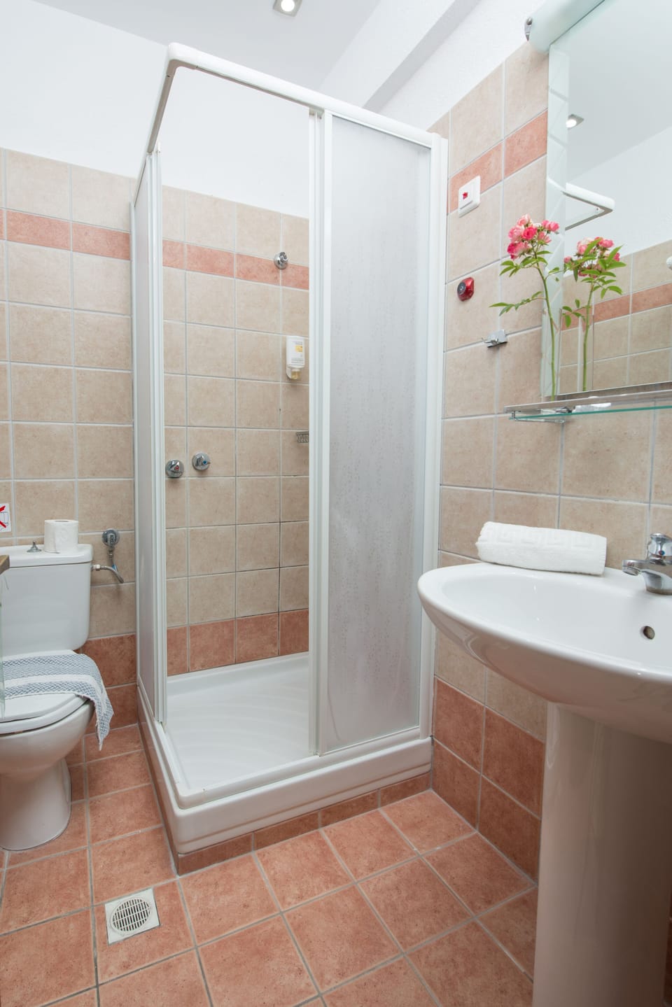 Shower, rainfall showerhead, hair dryer, towels