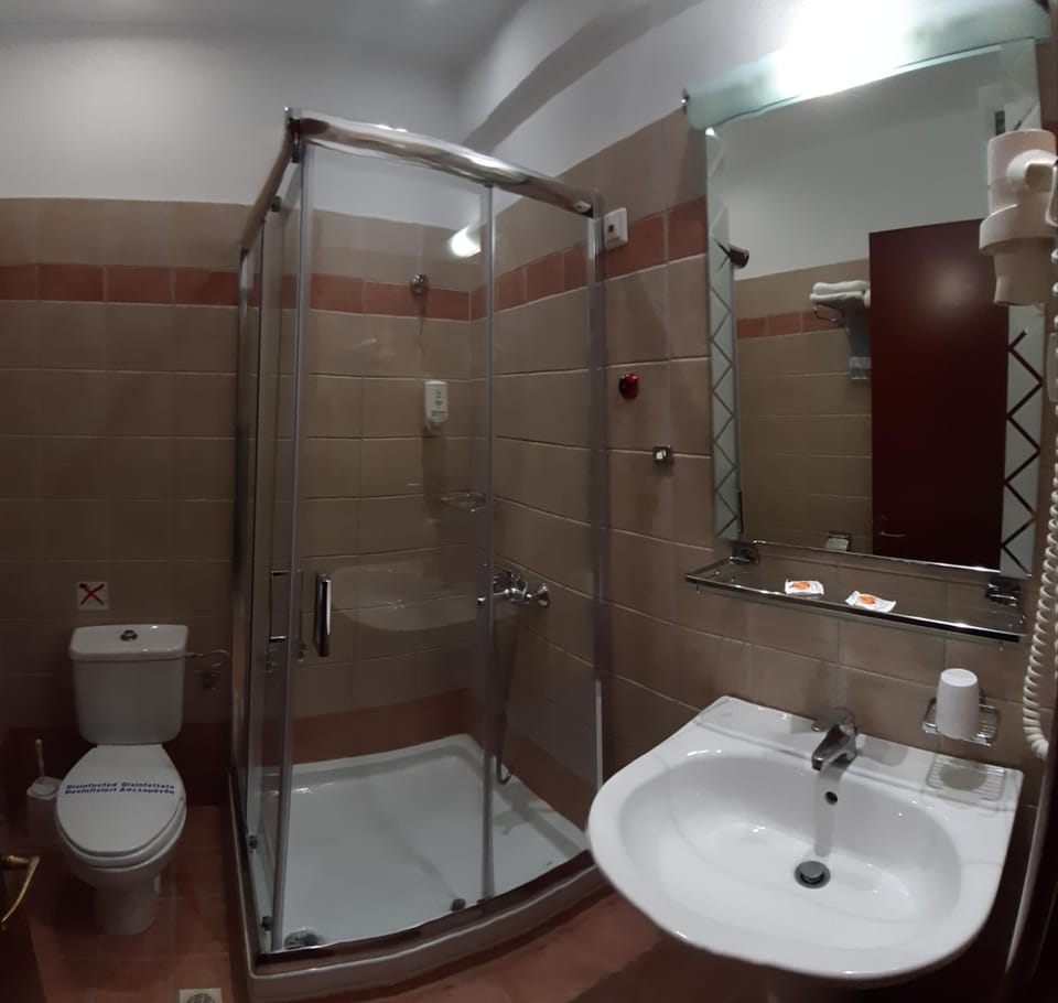 Shower, rainfall showerhead, hair dryer, towels