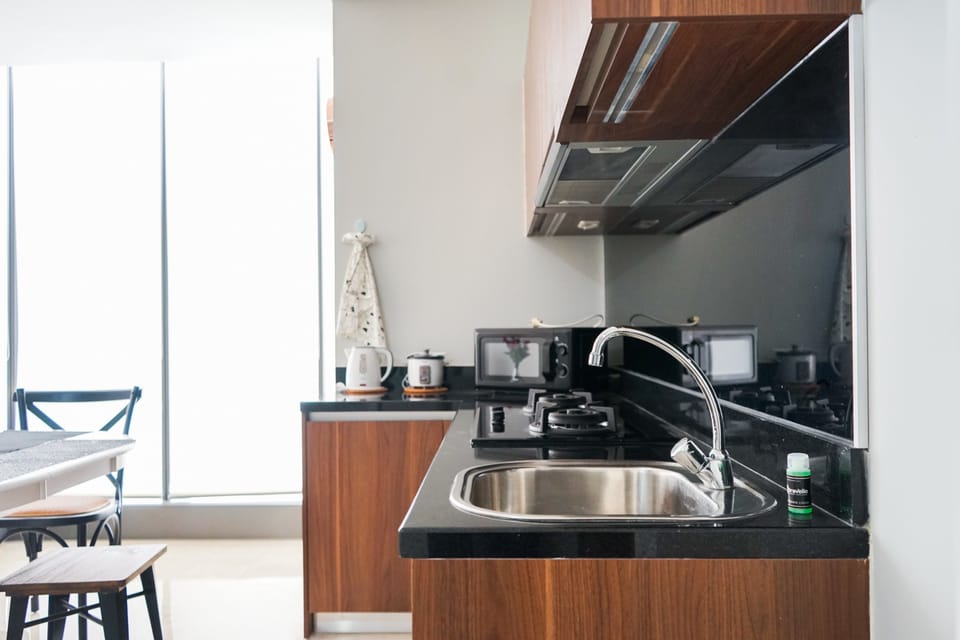 Fridge, stovetop, electric kettle, cookware/dishes/utensils