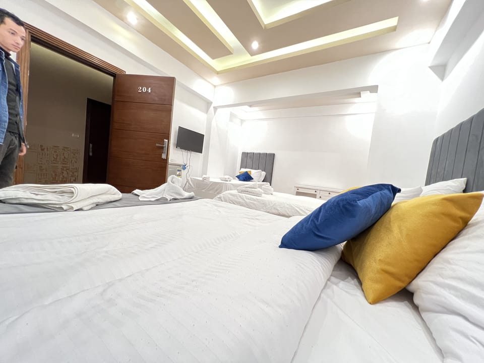 Triple Room | Minibar, blackout drapes, WiFi (free), individually decorated