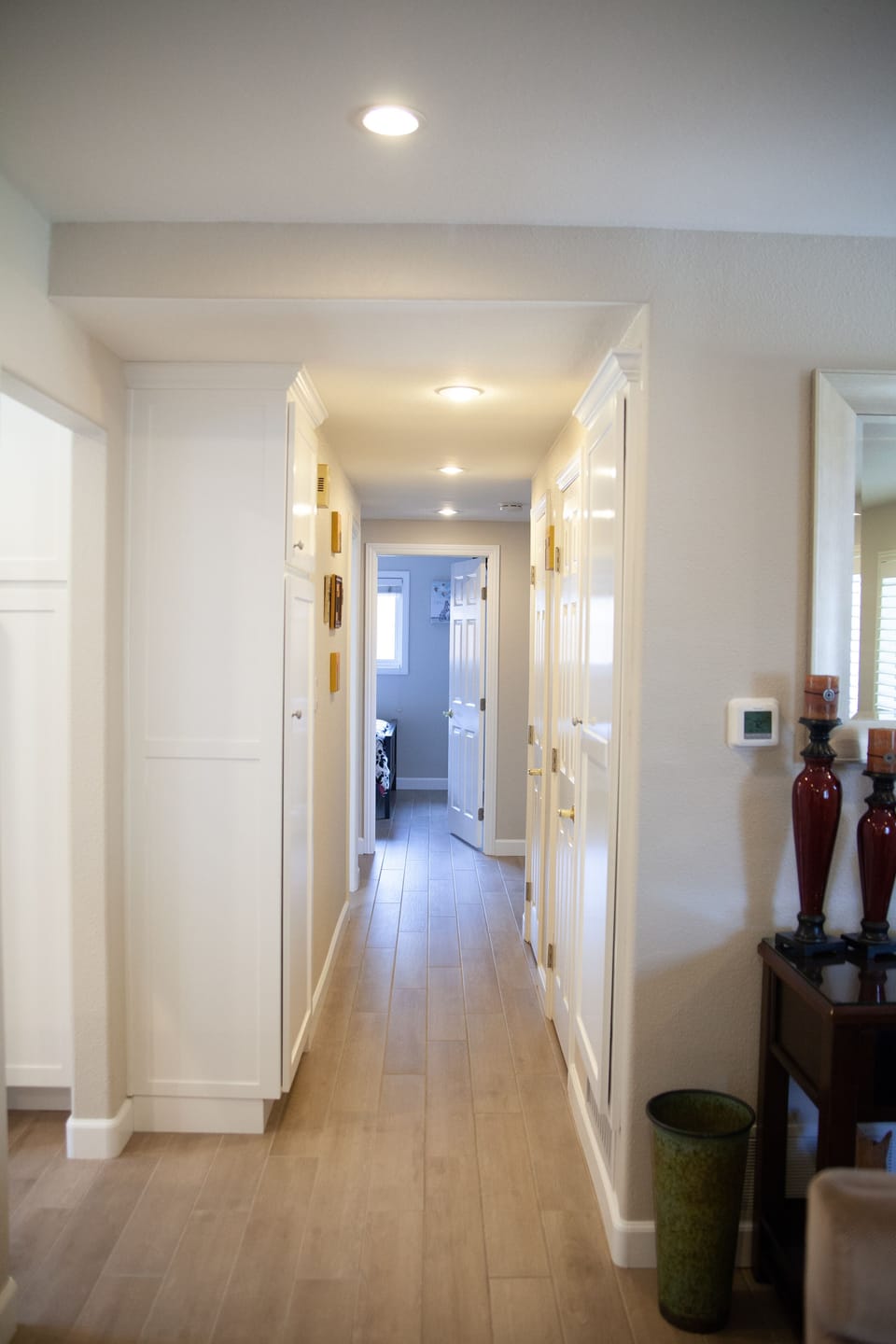 Newly tiled wood looking floors in hall and throughout home.