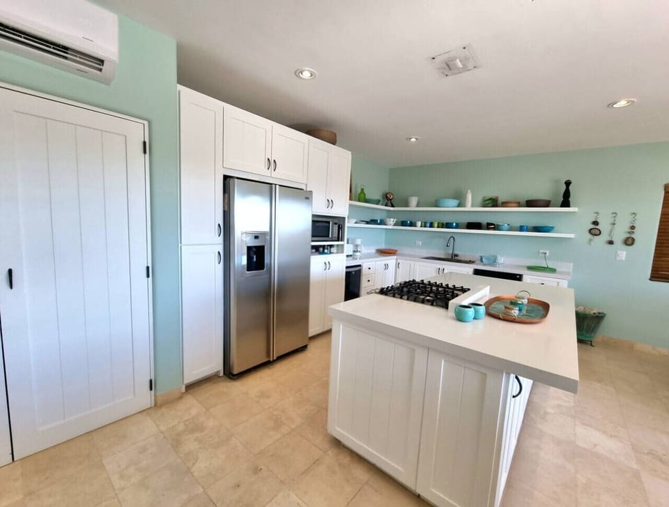 A spacious kitchen and dining area designed for cooking and gathering.