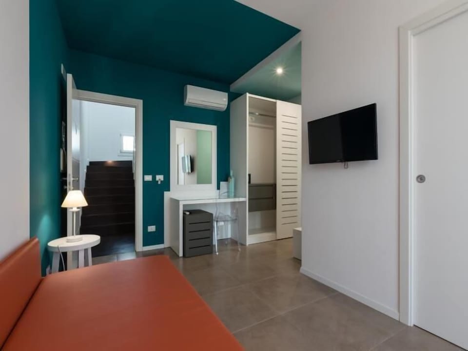 Quadruple Room, Balcony | Minibar, in-room safe, desk, blackout drapes