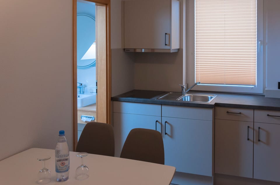 Family Room | Private kitchenette | Coffee/tea maker, electric kettle