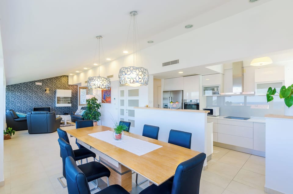 Villa (Four-Bedroom Villa, Swimming Pool) | Living room | 20-inch flat-screen TV with satellite channels, TV