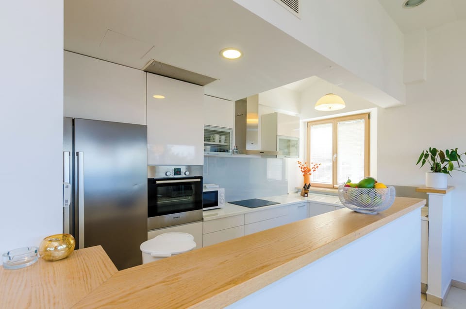 Villa (Four-Bedroom Villa, Swimming Pool) | Private kitchen | Fridge, stovetop, dishwasher, coffee/tea maker
