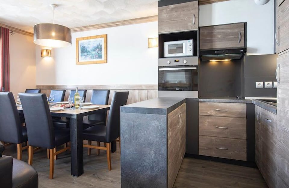 Prepare meals in the kitchen and enjoy them at the dining table.