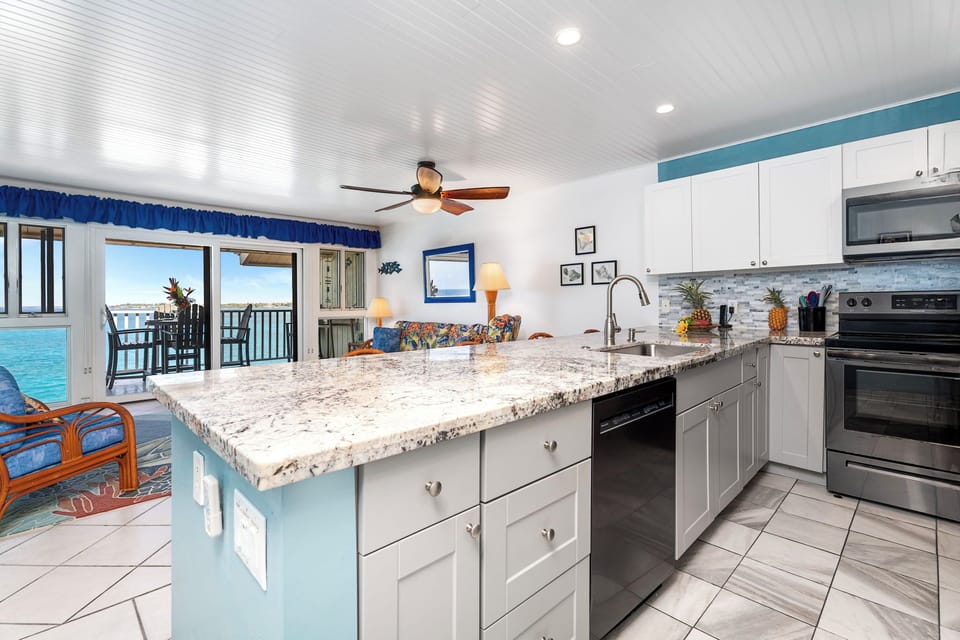 Kitchen Equipped with Dishwasher and Ocean Views while doing dishes