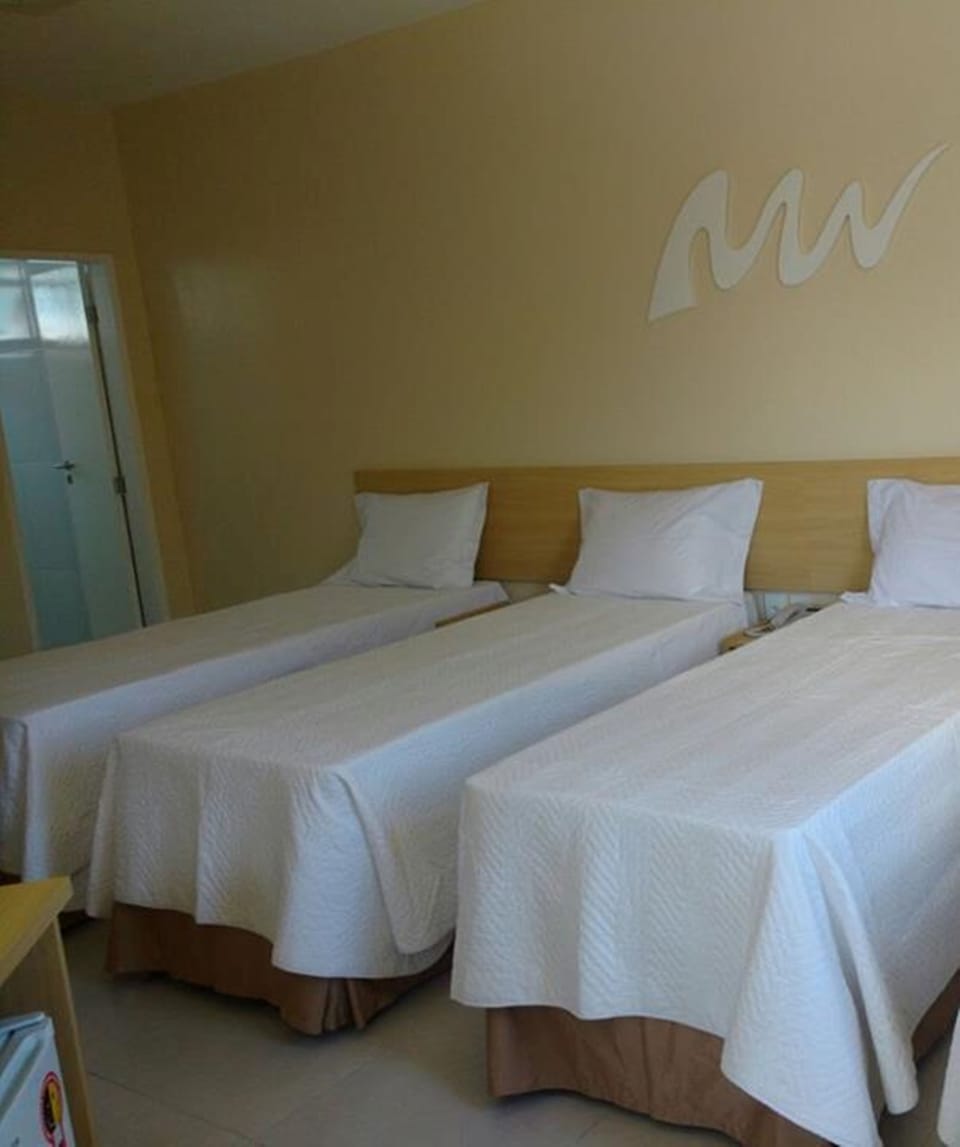 Standard Triple Room | Minibar, in-room safe, individually decorated, desk